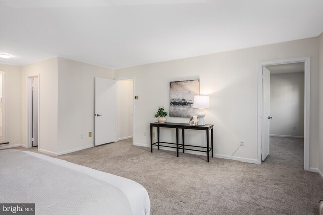 carpeted bedroom with baseboards