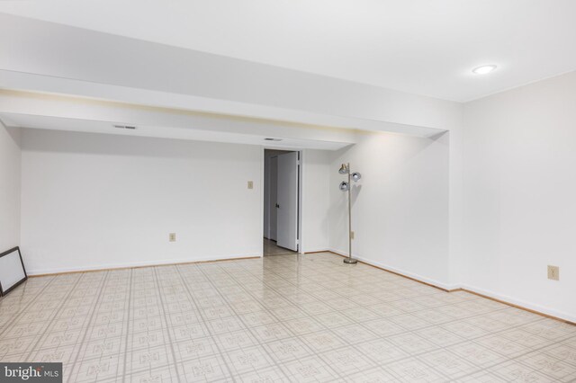 spare room with visible vents and baseboards