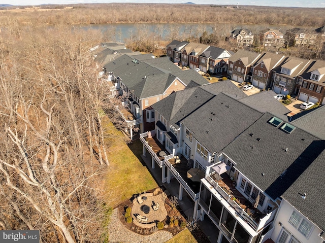 bird's eye view featuring a residential view and a water view