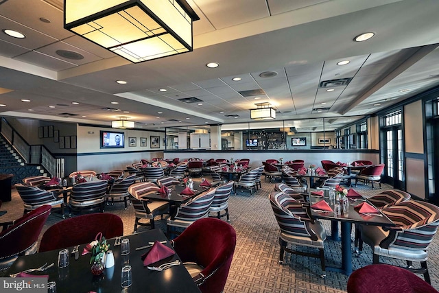 dining space featuring carpet floors, visible vents, and recessed lighting