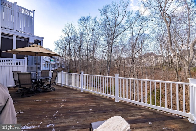 wooden deck featuring outdoor dining space