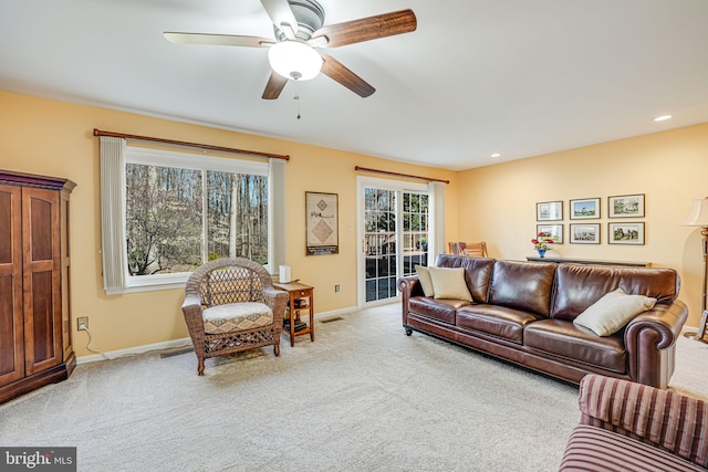 living area featuring visible vents, recessed lighting, baseboards, and carpet