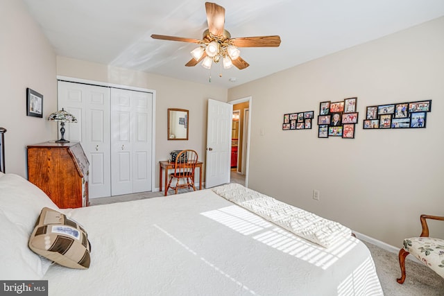 bedroom with carpet flooring, a ceiling fan, a closet, and baseboards