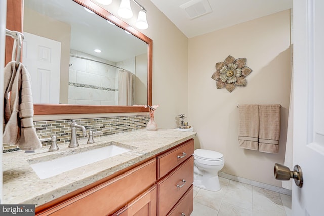 bathroom with visible vents, toilet, tile patterned flooring, decorative backsplash, and vanity