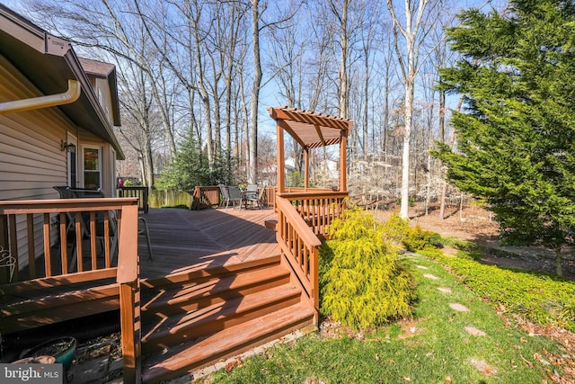 wooden terrace with outdoor dining space