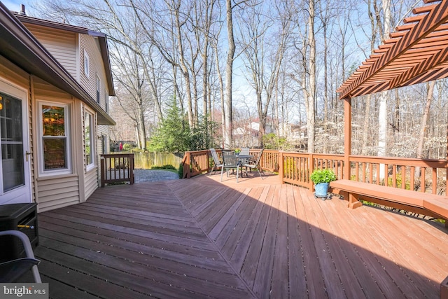 wooden terrace featuring outdoor dining area