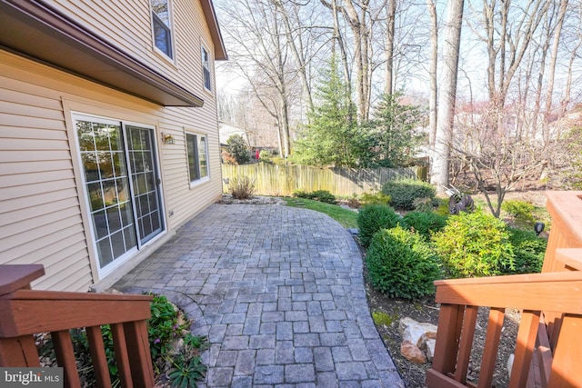 view of patio featuring fence