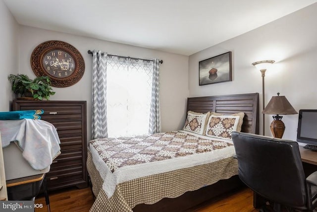 bedroom featuring dark wood-type flooring