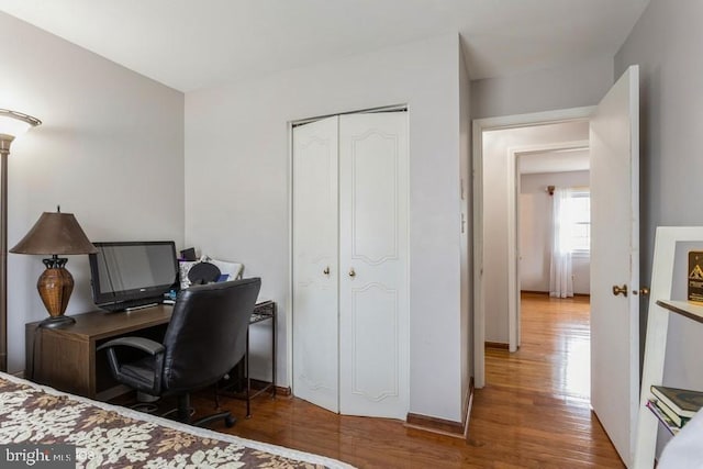 bedroom featuring a closet and wood finished floors