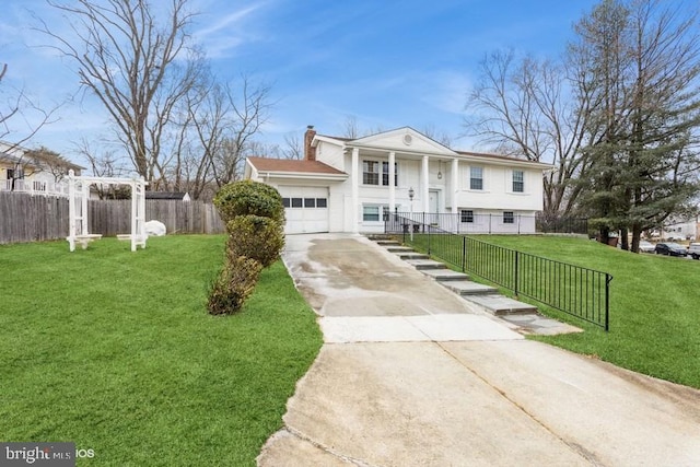 view of front facade featuring driveway, a garage, a chimney, fence, and a front lawn