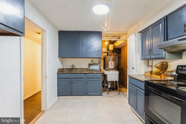 kitchen featuring blue cabinetry, electric range, a sink, dark stone counters, and under cabinet range hood