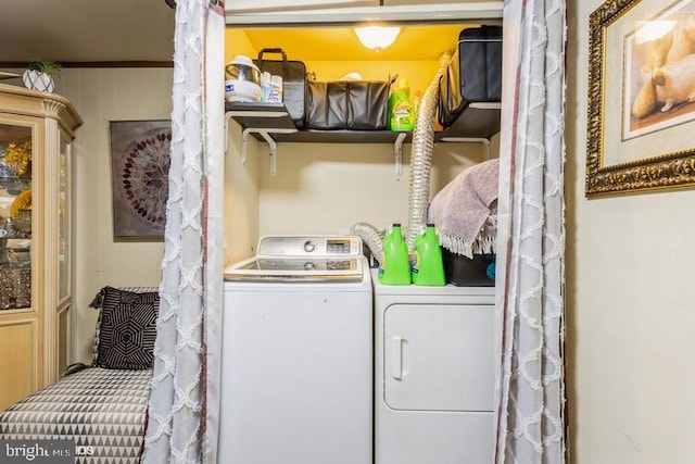 clothes washing area with laundry area and independent washer and dryer