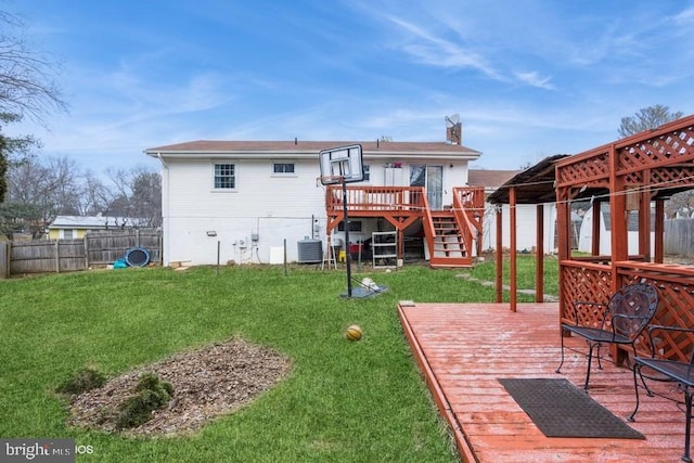 rear view of house featuring a lawn, stairway, fence, cooling unit, and a wooden deck