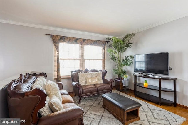 living room featuring ornamental molding, light wood-style flooring, and baseboards