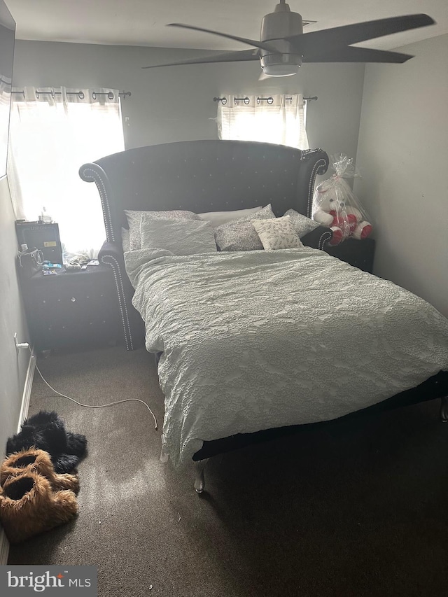 carpeted bedroom featuring a ceiling fan