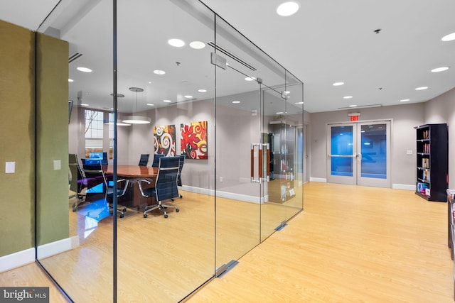 office with recessed lighting, french doors, baseboards, and wood finished floors