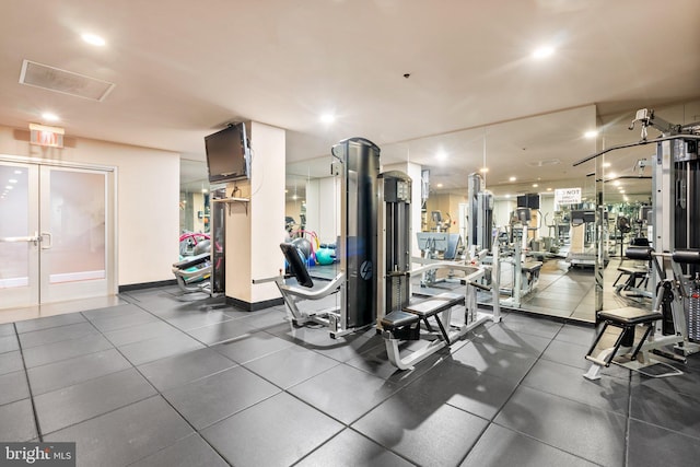 gym featuring french doors, recessed lighting, and baseboards