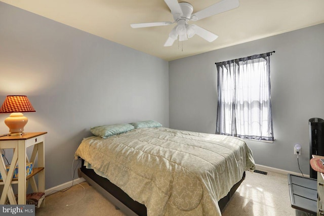 bedroom with visible vents, a ceiling fan, and baseboards