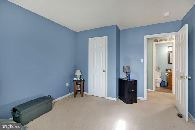 carpeted bedroom featuring baseboards