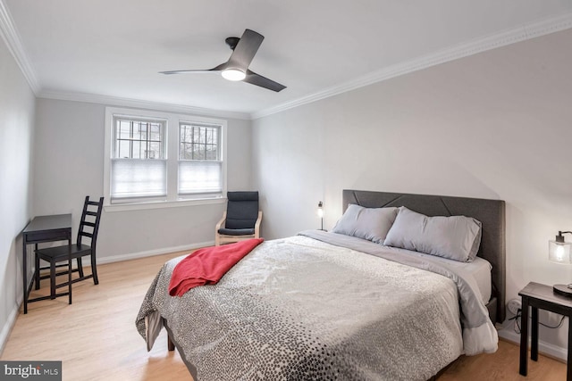 bedroom featuring light wood-style floors, ceiling fan, baseboards, and crown molding