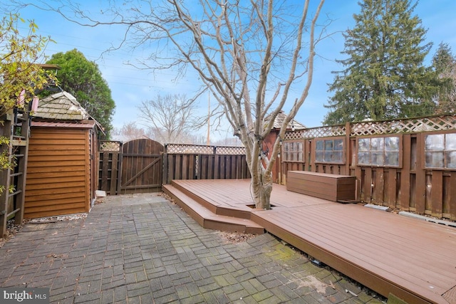 deck featuring fence and a gate