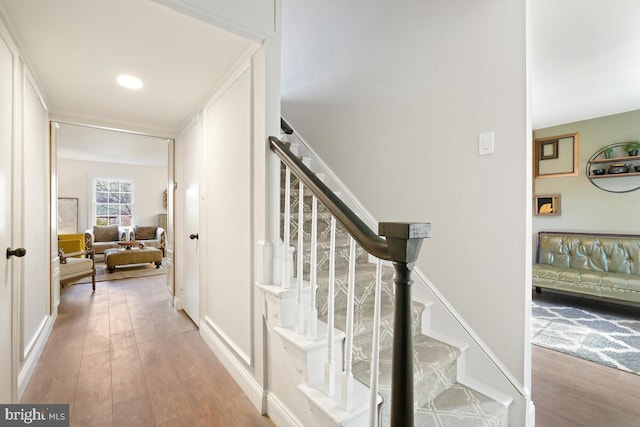 stairway with wood finished floors