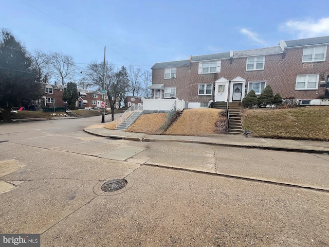 view of street with sidewalks and curbs