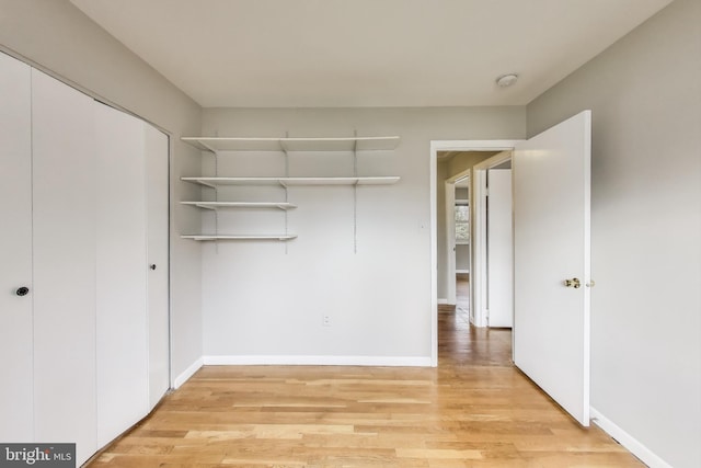 spacious closet featuring light wood-style floors