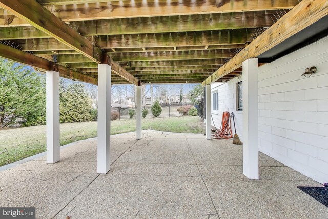 view of patio featuring fence