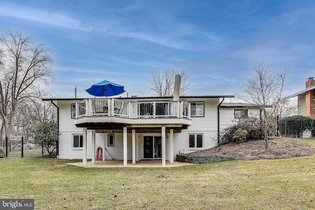 back of property featuring a patio area, fence, a deck, and a yard