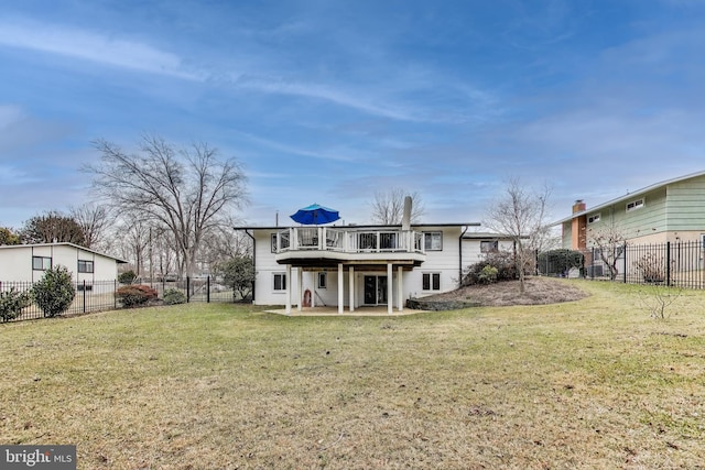 back of house featuring a patio area, a fenced backyard, a lawn, and a deck