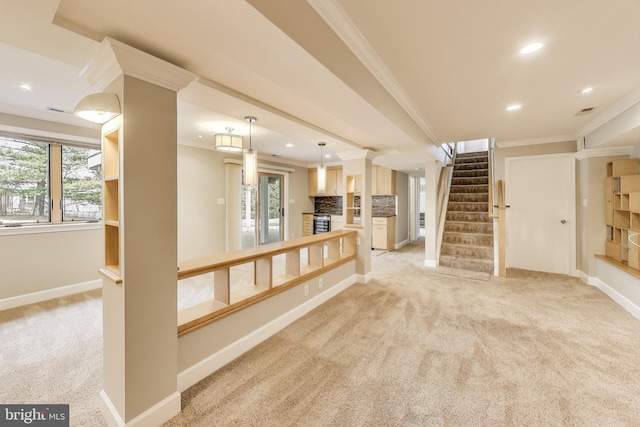 spare room with light carpet, crown molding, stairway, and baseboards