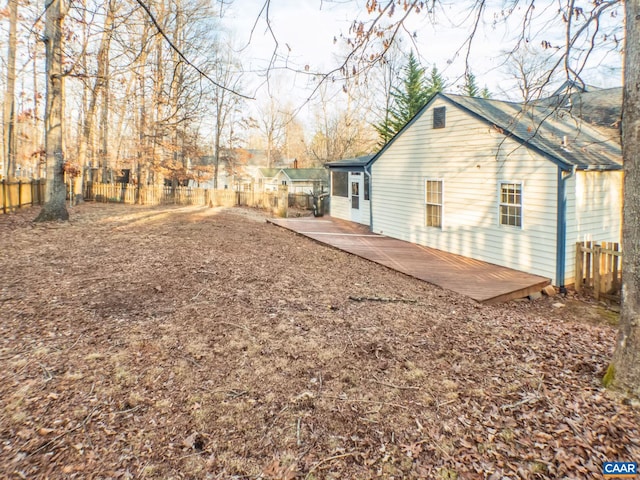 view of side of home featuring a fenced backyard