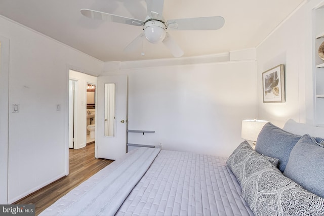 bedroom with a ceiling fan and wood finished floors