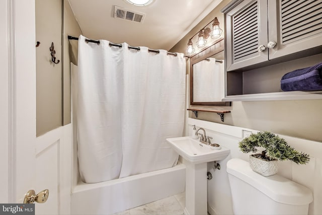 full bathroom with visible vents, shower / tub combo with curtain, and toilet