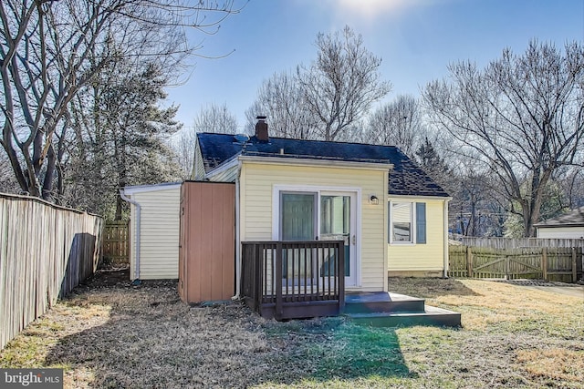 view of outdoor structure featuring a fenced backyard