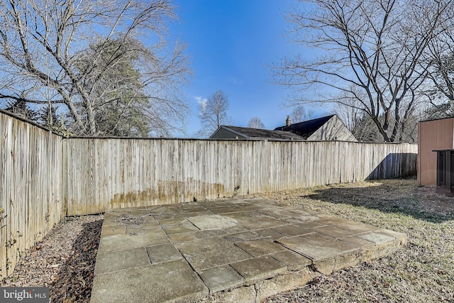 exterior space with a patio and a fenced backyard