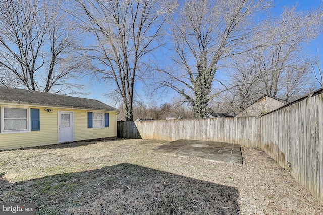 view of yard featuring a patio area and a fenced backyard