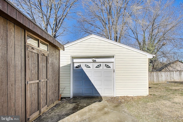 detached garage with fence