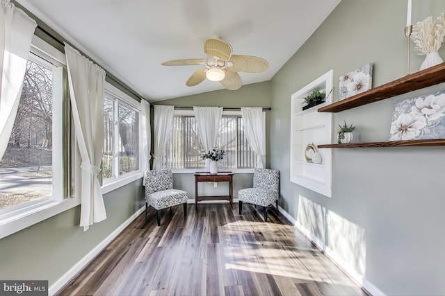 sunroom featuring vaulted ceiling and a ceiling fan