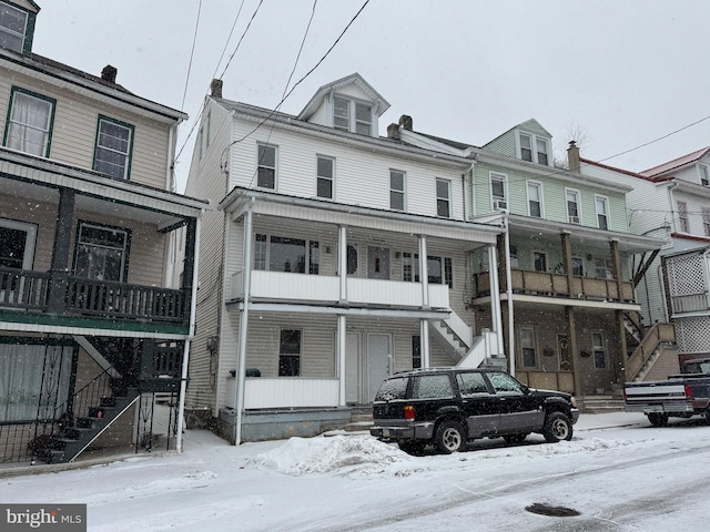 view of front of house with stairs