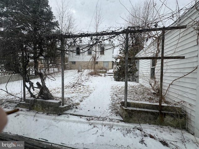 view of yard covered in snow