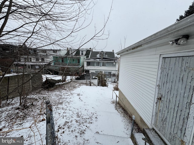 view of yard layered in snow