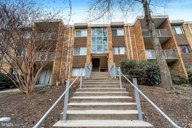 view of property featuring stairway