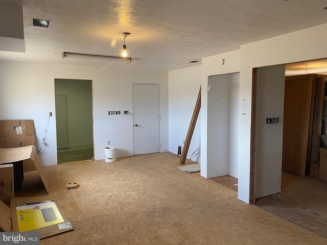 unfurnished bedroom with a textured ceiling