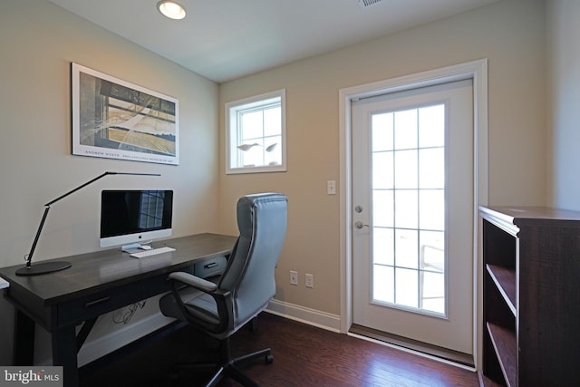 home office with dark wood-style floors and baseboards