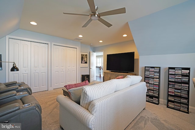 living area with recessed lighting, lofted ceiling, light colored carpet, visible vents, and ceiling fan