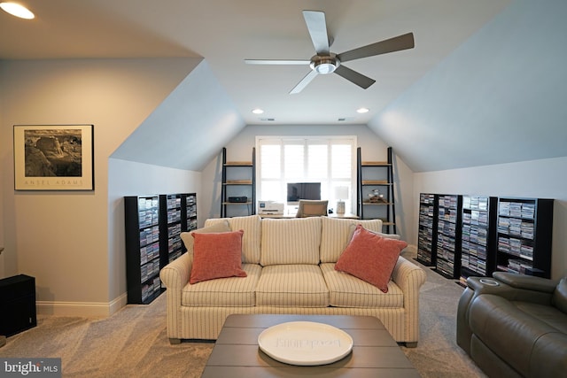 living area featuring recessed lighting, light colored carpet, vaulted ceiling, and baseboards