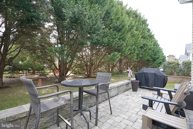 view of patio with a grill