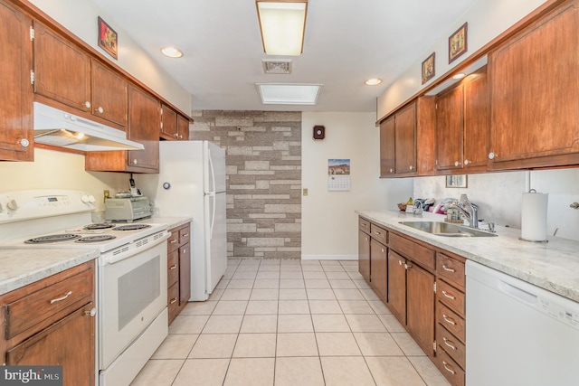 kitchen featuring light countertops, white appliances, a sink, and under cabinet range hood